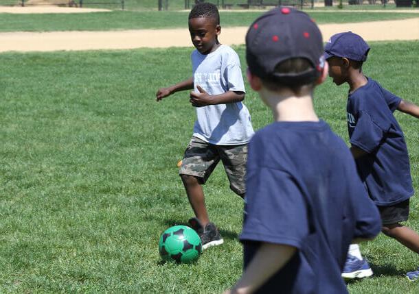 Poly Prep Lower School students playing soccer