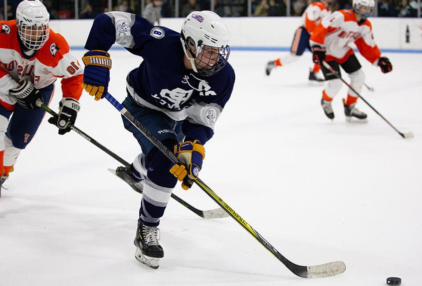 Poly Prep students playing hockey